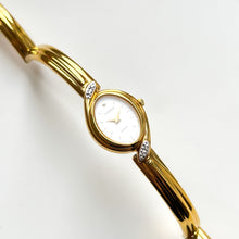 Load image into Gallery viewer, Very Rare 1990s Gold-Plated Lassale (Seiko) Articulated Bangle Quartz Watch with Mother of Pearl Dial and Diamond-Set Bezel
