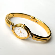 Load image into Gallery viewer, Very Rare 1990s Gold-Plated Lassale (Seiko) Articulated Bangle Quartz Watch with Mother of Pearl Dial and Diamond-Set Bezel
