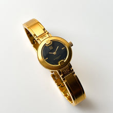 Load image into Gallery viewer, Vintage Gold-Plated Ladies&#39; Givenchy Bangle Watch with Black Dial and Quartz Movement
